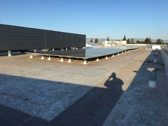 Commercial rooftop solar panel and battery energy storage system with panoramic city view